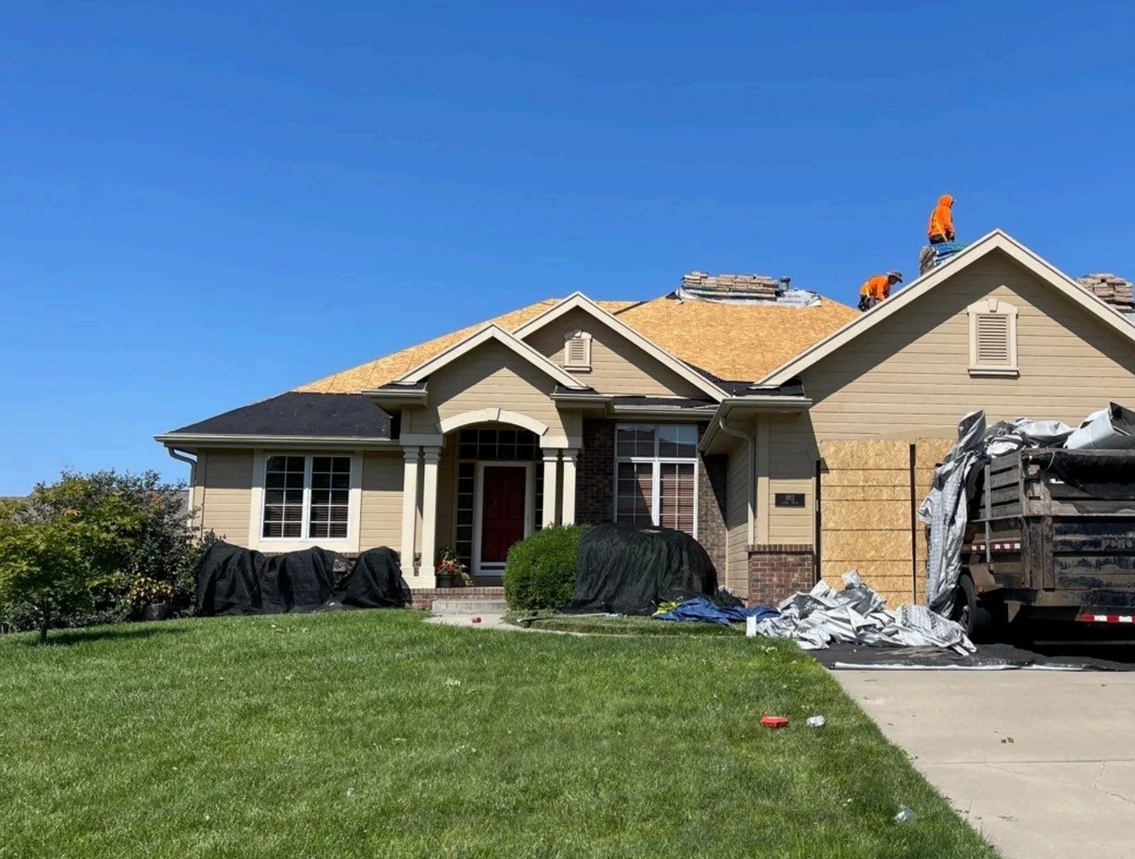 A Rocket Roofing General Contractor crew replacing a residential roof in Omaha.